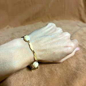 Authentic vintage gold tone bracelet with rose flowers.